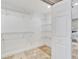 Spacious walk-in closet with wire shelving, providing ample storage at 1024 Sonata Ln, Apollo Beach, FL 33572
