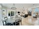 Open concept dining room with large chandelier and water views at 1024 Sonata Ln, Apollo Beach, FL 33572