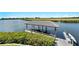 Private dock with covered boat lift and tranquil water views at 1024 Sonata Ln, Apollo Beach, FL 33572