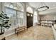 Spacious entryway with elegant chandelier and tile flooring at 1024 Sonata Ln, Apollo Beach, FL 33572