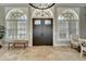 Bright and airy entryway with double doors and arched windows at 1024 Sonata Ln, Apollo Beach, FL 33572
