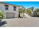 Two-story house with a large driveway and palm trees at 1024 Sonata Ln, Apollo Beach, FL 33572