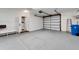 Attached garage with additional storage shelving at 1024 Sonata Ln, Apollo Beach, FL 33572