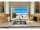 Kitchen sink with a view of the water at 1024 Sonata Ln, Apollo Beach, FL 33572