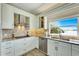 Modern kitchen with stainless steel appliances and granite countertops at 1024 Sonata Ln, Apollo Beach, FL 33572
