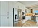 Modern kitchen with stainless steel appliances and granite countertops at 1024 Sonata Ln, Apollo Beach, FL 33572