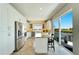 Eat-in kitchen with island, stainless steel appliances and water views at 1024 Sonata Ln, Apollo Beach, FL 33572