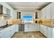 Modern kitchen with water views and stainless steel appliances at 1024 Sonata Ln, Apollo Beach, FL 33572