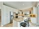 Modern kitchen with stainless steel appliances and granite island at 1024 Sonata Ln, Apollo Beach, FL 33572