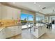 Kitchen with island, water views and access to pool at 1024 Sonata Ln, Apollo Beach, FL 33572