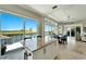 Kitchen with island, water views and access to pool at 1024 Sonata Ln, Apollo Beach, FL 33572
