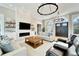 Bright living room featuring a fireplace, built-ins and stylish furnishings at 1024 Sonata Ln, Apollo Beach, FL 33572