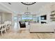 Open concept living room with water views and a large sectional at 1024 Sonata Ln, Apollo Beach, FL 33572