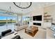 Open living space showcasing a fireplace and water views at 1024 Sonata Ln, Apollo Beach, FL 33572