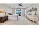 Main bedroom with a king-size bed and large windows at 1024 Sonata Ln, Apollo Beach, FL 33572