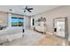 Serene main bedroom with plenty of natural light and an ensuite bathroom at 1024 Sonata Ln, Apollo Beach, FL 33572