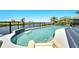Relaxing kidney-shaped pool with water views at 1024 Sonata Ln, Apollo Beach, FL 33572