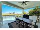 Relaxing pool area with patio furniture and stunning water views at 1024 Sonata Ln, Apollo Beach, FL 33572