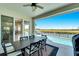 Covered patio overlooking the pool and serene landscape at 1024 Sonata Ln, Apollo Beach, FL 33572