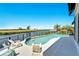 Relaxing pool and patio overlooking the water at 1024 Sonata Ln, Apollo Beach, FL 33572