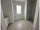 Simple bathroom with marble flooring and a walk-in shower at 10658 Rainsville St, Port Charlotte, FL 33981