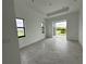 Bright bedroom with backyard access and marble tile floors at 10658 Rainsville St, Port Charlotte, FL 33981
