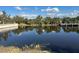 Tranquil canal view with dock and lush vegetation at 10658 Rainsville St, Port Charlotte, FL 33981
