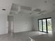 Bright living room with high ceilings and sliding glass doors leading to the backyard at 10658 Rainsville St, Port Charlotte, FL 33981