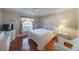 Bedroom with white wicker furniture and hardwood floors at 11440 Baronwood Ct, Hudson, FL 34667