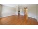 Spacious bedroom with wood flooring and access to bathroom at 11440 Baronwood Ct, Hudson, FL 34667