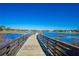 Boardwalk path over water with scenic views of community at 11440 Baronwood Ct, Hudson, FL 34667