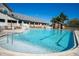 Resort-style pool with lounge chairs and a large deck at 11440 Baronwood Ct, Hudson, FL 34667