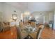 Charming dining area with hardwood floors and glass-top table at 11440 Baronwood Ct, Hudson, FL 34667