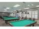 Community game room with multiple billiard tables at 11440 Baronwood Ct, Hudson, FL 34667