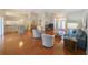 Open living area with hardwood floors, vaulted ceilings, and ample natural light at 11440 Baronwood Ct, Hudson, FL 34667