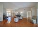 Bright and airy living room with hardwood floors and a view to the backyard at 11440 Baronwood Ct, Hudson, FL 34667