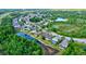 Aerial view of the community near a highway at 12211 Oak Ramble Dr, Spring Hill, FL 34610