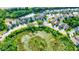 Aerial view of the community with pond and conservation at 12211 Oak Ramble Dr, Spring Hill, FL 34610