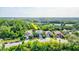 Aerial view showcasing a house on a quiet street with conservation area at 12211 Oak Ramble Dr, Spring Hill, FL 34610