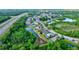 Aerial view of the community near a highway at 12211 Oak Ramble Dr, Spring Hill, FL 34610