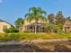 House exterior view, backyard, lush grass at 12211 Oak Ramble Dr, Spring Hill, FL 34610