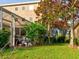 Landscaped backyard with lush greenery at 12211 Oak Ramble Dr, Spring Hill, FL 34610