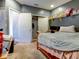 Cozy bedroom with a double bed, a desk, and a large closet at 12211 Oak Ramble Dr, Spring Hill, FL 34610