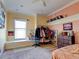 Bedroom with window seat, built-in shelving, and a closet at 12211 Oak Ramble Dr, Spring Hill, FL 34610
