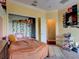 Light and airy bedroom with a built-in closet and window at 12211 Oak Ramble Dr, Spring Hill, FL 34610