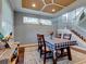 Dining area with hardwood floors and a coffered ceiling at 12211 Oak Ramble Dr, Spring Hill, FL 34610