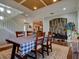 Bright dining room features a wooden table, chairs, and a checkered tablecloth at 12211 Oak Ramble Dr, Spring Hill, FL 34610