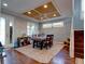 Dining area with hardwood floors and a coffered ceiling at 12211 Oak Ramble Dr, Spring Hill, FL 34610