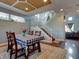 Spacious dining area with hardwood floors and a view of the staircase at 12211 Oak Ramble Dr, Spring Hill, FL 34610