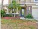 Two story house exterior with palm trees and stone accents at 12211 Oak Ramble Dr, Spring Hill, FL 34610